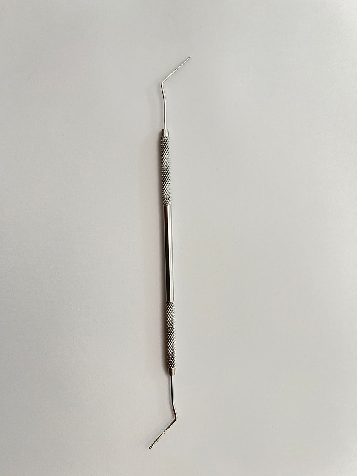 Sonda de dos puntas periodontal arain