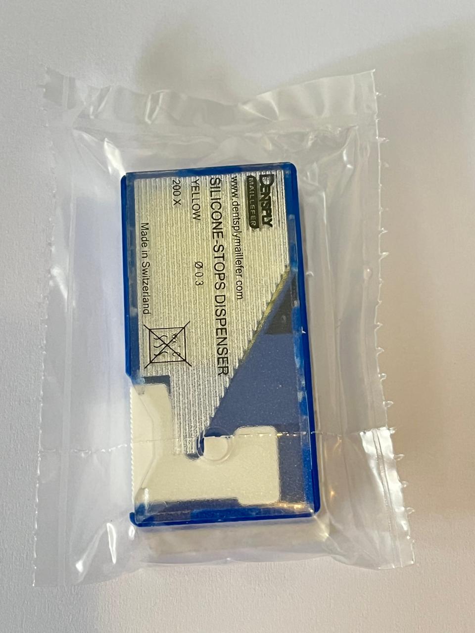 Topes de silicón amarillo con 200 piezas con dispensador marca Dentsply