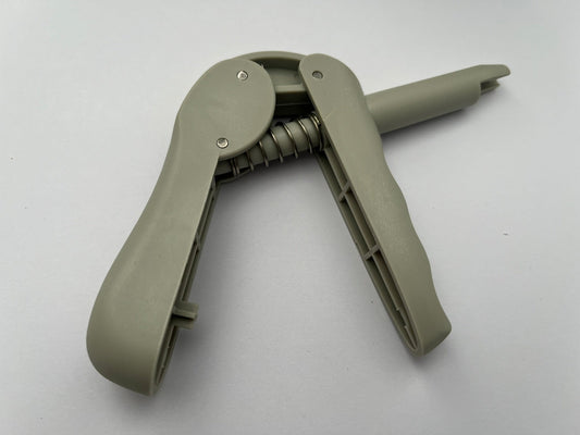 Pistola aplicádora de compules universal.